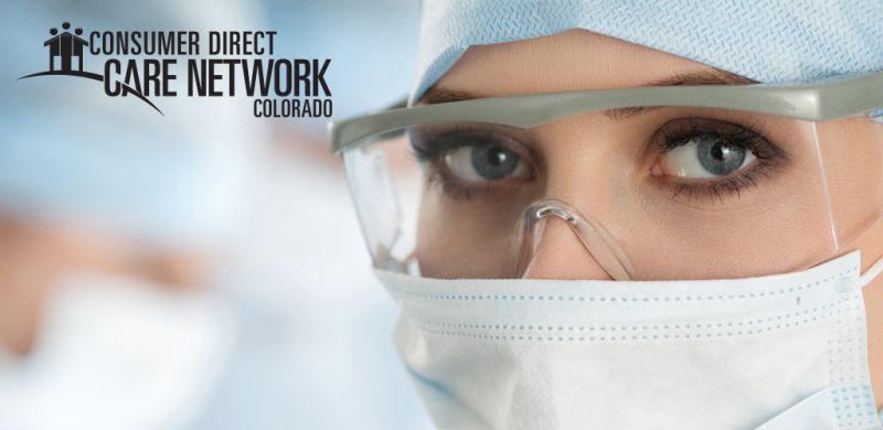 Female nurse's face with her surgical mask on.